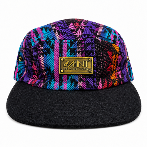 Colorful patterned cap with a black brim on a white background