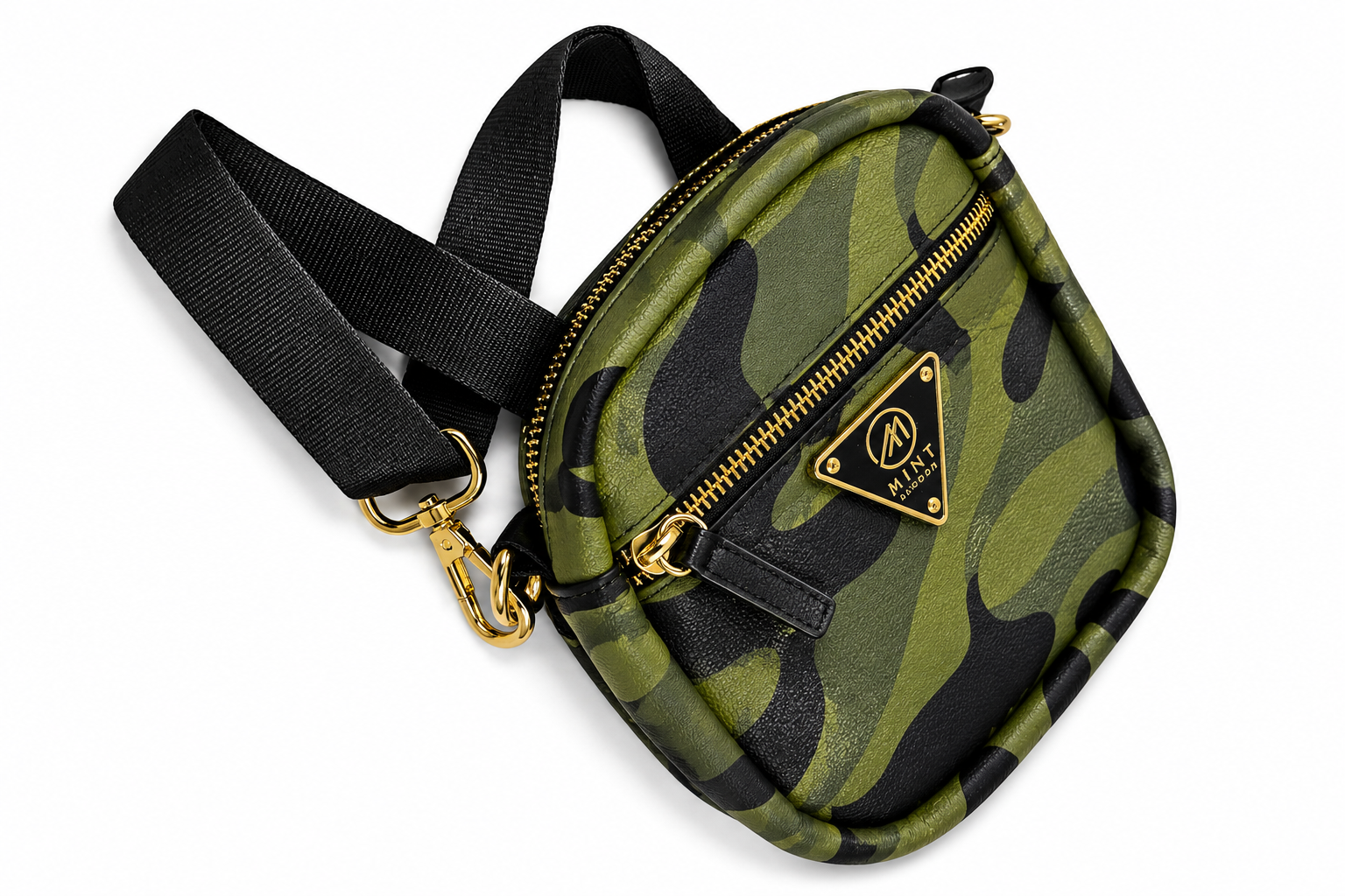Camouflage-patterned bag with gold zipper and black strap on a white background