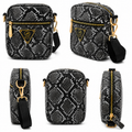 Black and white patterned crossbody bag with gold accents on a white background