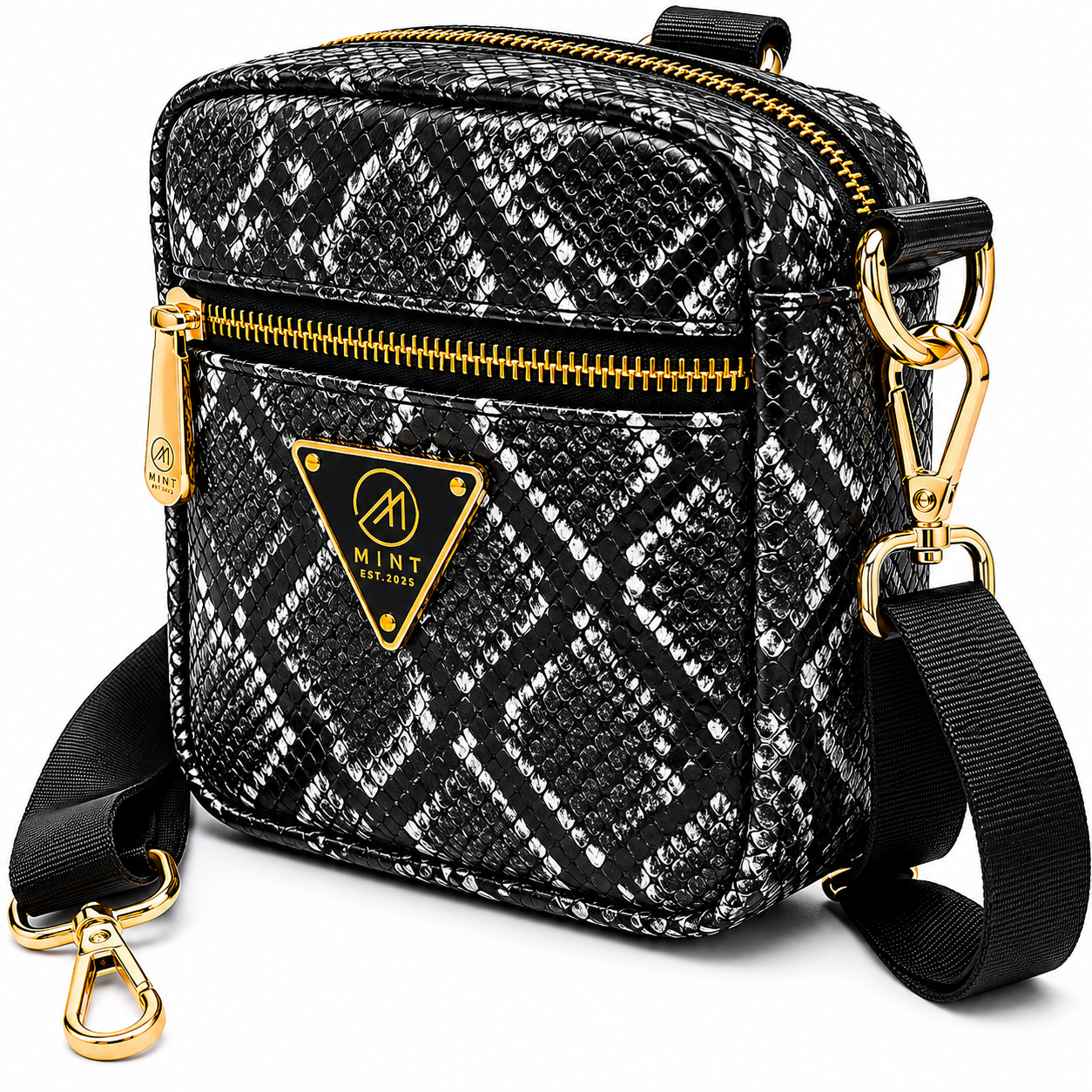 Black and white patterned crossbody bag with gold accents on a white background