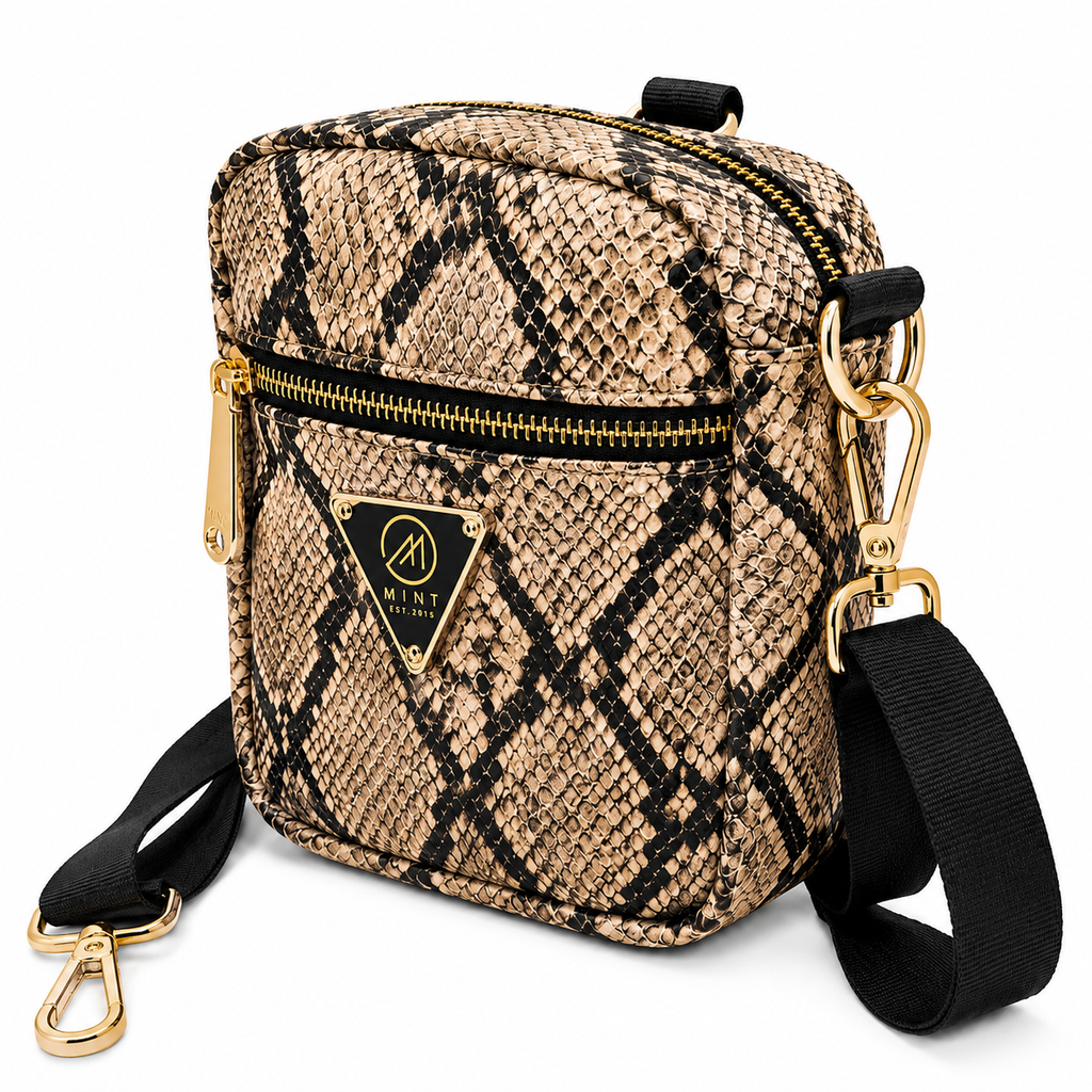 Woven crossbody bag with black and gold accents on a white background