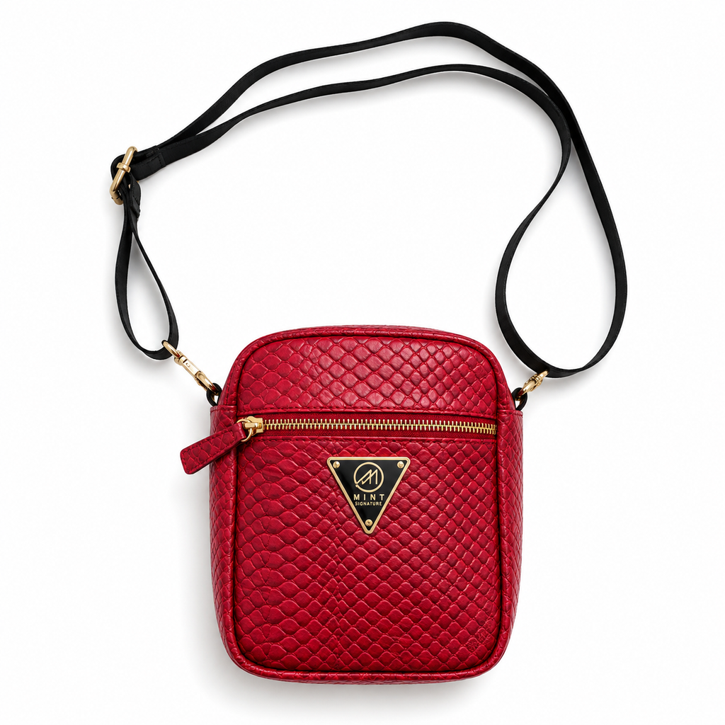Red quilted crossbody bag with gold zipper and brand logo on a white background