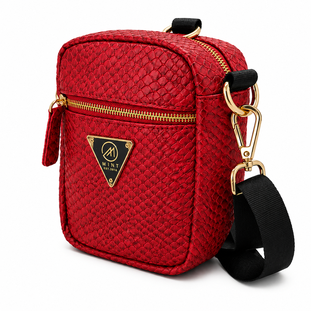 Red quilted handbag with gold accents and a visible brand logo on a white background