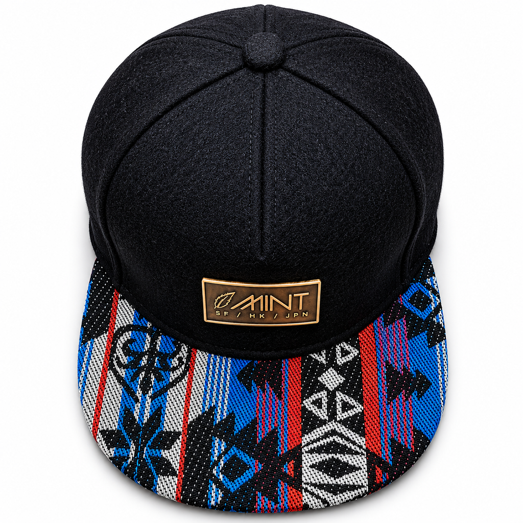 Black cap with a colorful patterned brim and a brand logo on a white background