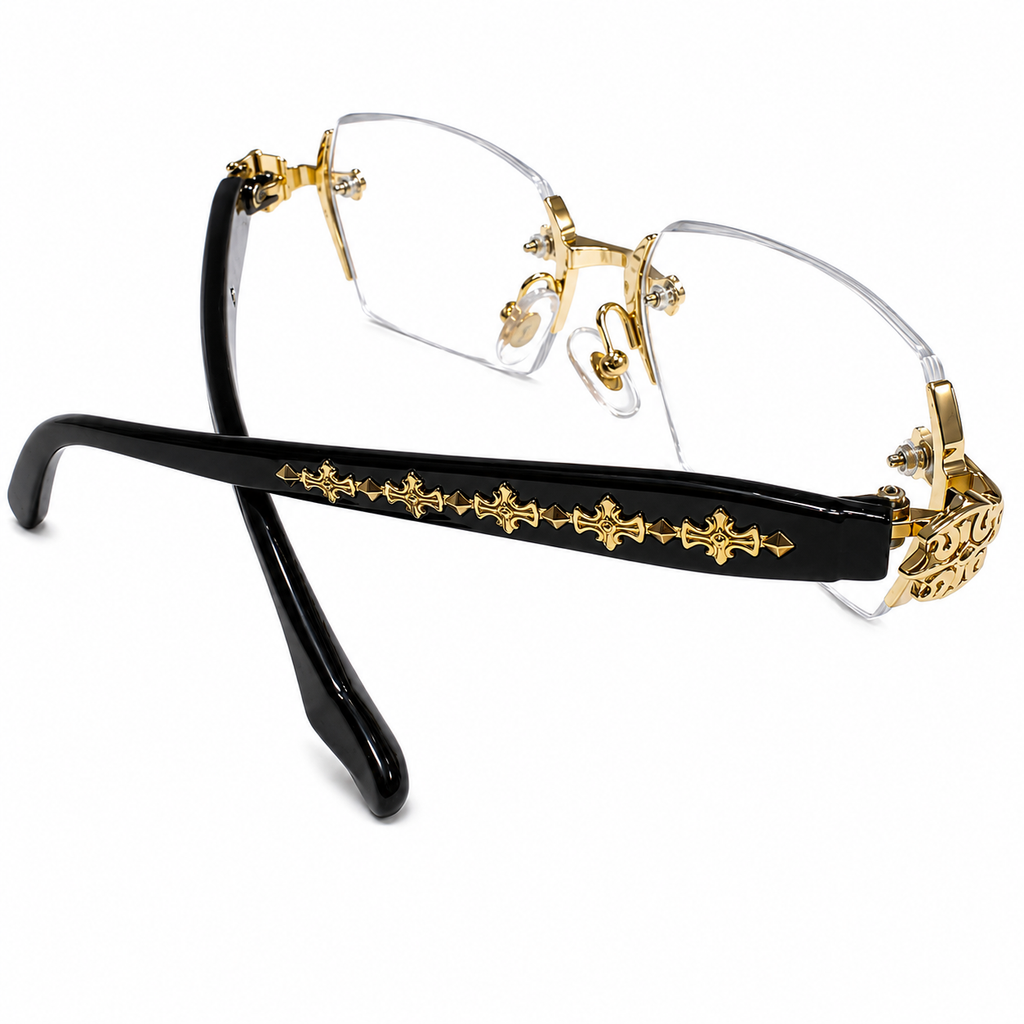 Gold and black decorative eyeglasses on a white background