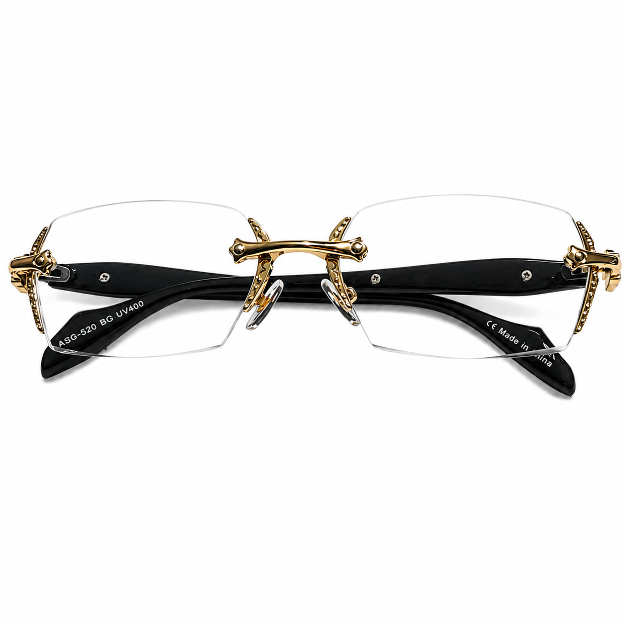 Gold and black rimless eyeglasses on a white background